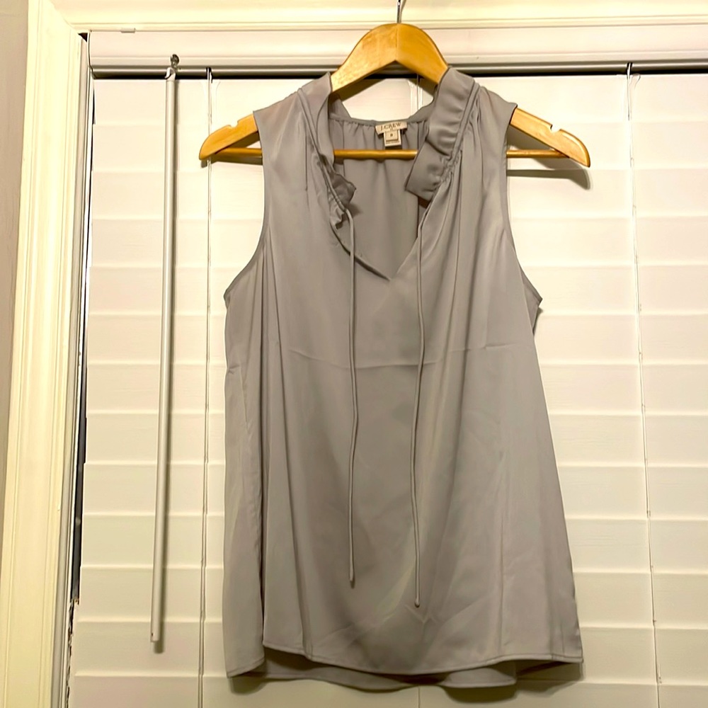 Jcrew gray top with ruffled neck. Size 8.